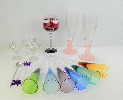 Lot 343 - A set of coloured glass champagne flutes...