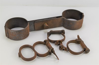 Lot 507 - A pair of 19th century handcuffs with key and...