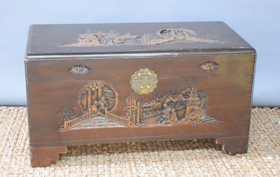 Lot 632 - A Chinese carved wooden chest, carved with...