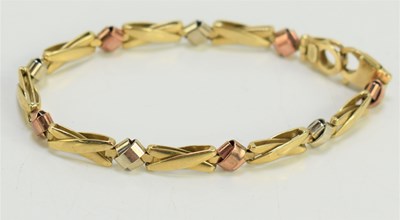 Lot 188 - A 9ct gold tricolour bracelet with crab claw...