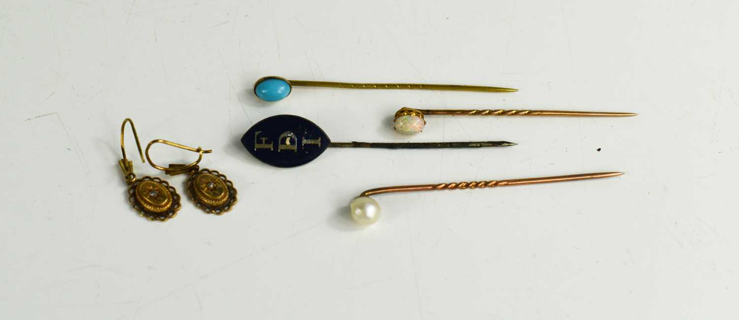 Lot 160 - Three gold hat pins, one set with a pearl, an...