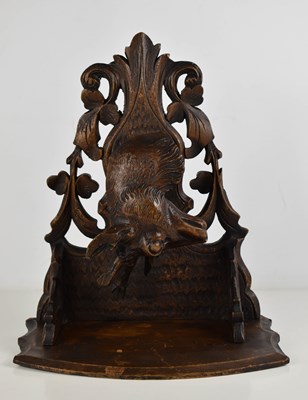 Lot 438 - A Blackforest style wall bracket, carved in...