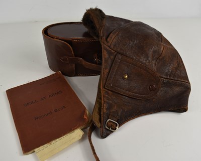 Lot 484 - A leather pilots hat and Discharge papers,...