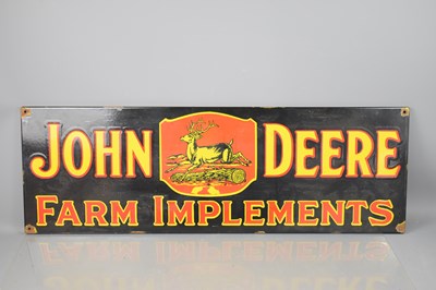 Lot 319 - A steel and enamel John Deere Farm Implements...