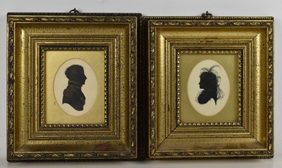 Lot 553 - A pair of hand painted silhouette portrait...