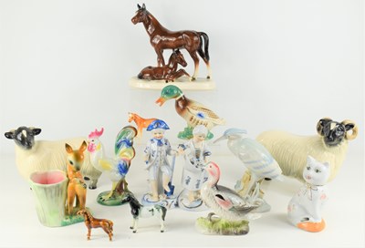 Lot 334 - A group of ceramic animals and figures to...