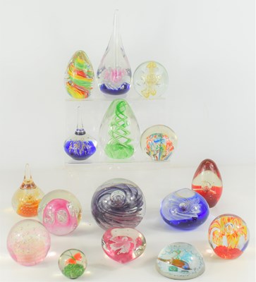 Lot 357 - A group of glass paperweights of various...