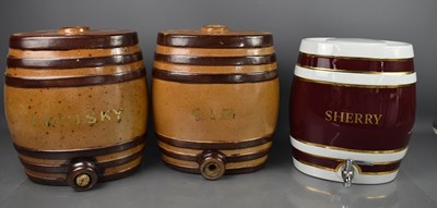 Lot 398 - A pair of stoneware glazed Gin and Whisky...