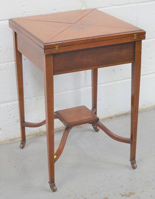 Lot 630 - An Edwardian mahogany folding quarter top card...