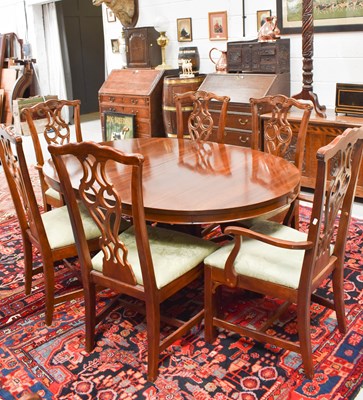 Lot 636 - An American Chippendale style dining table...