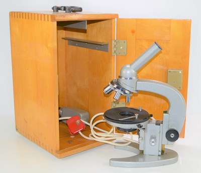 Lot 225 - A vintage microscope in a beech case.