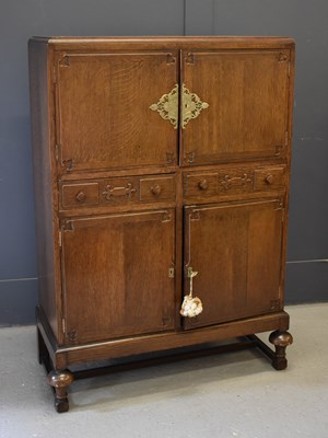 Lot 649 - An early 20th century oak cabinet of Chinese...