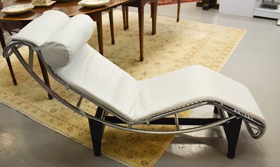 Lot 82 - A Le Corbusier style white leather chaise...