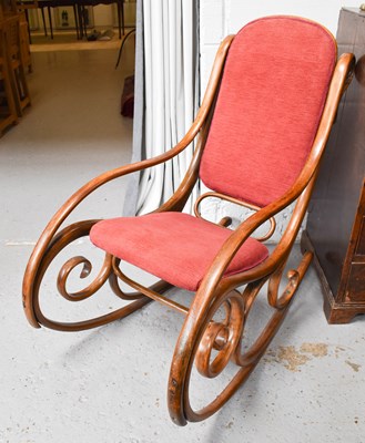 Lot 647 - A vintage bentwood rocking chair with boldly...