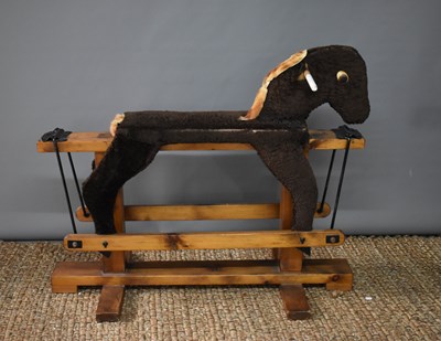 Lot 631 - A vintage handmade rocking horse covered in...