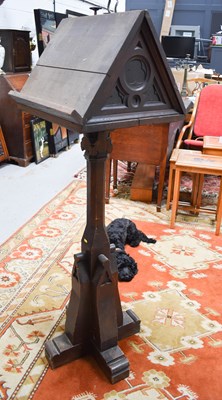 Lot 208 - A gothic style oak lectern with twin book...