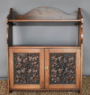 Lot 77 - An oak Arts and Crafts period wall cabinet,...