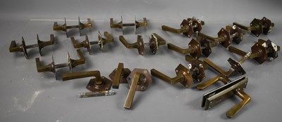 Lot 291 - Fourteen pairs of Art Deco brass door handles...