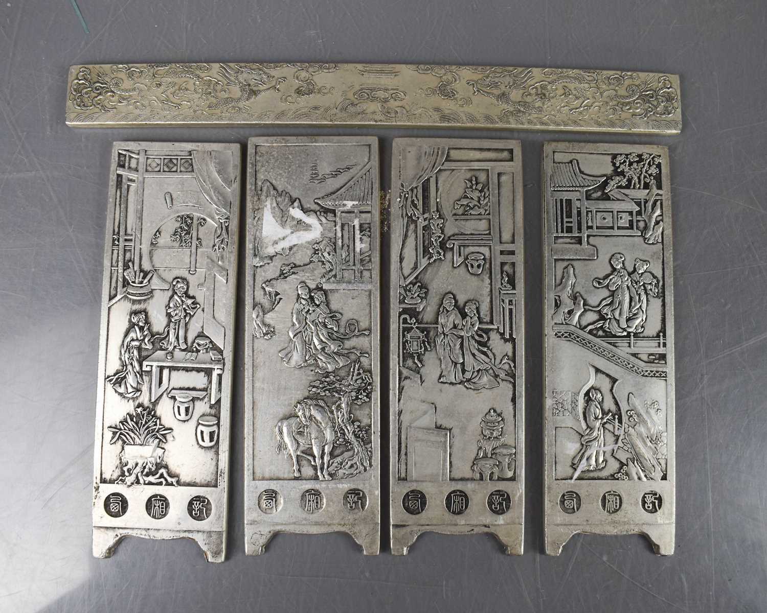 Lot 290 - Two pairs of white metal Chinese scroll rests,...