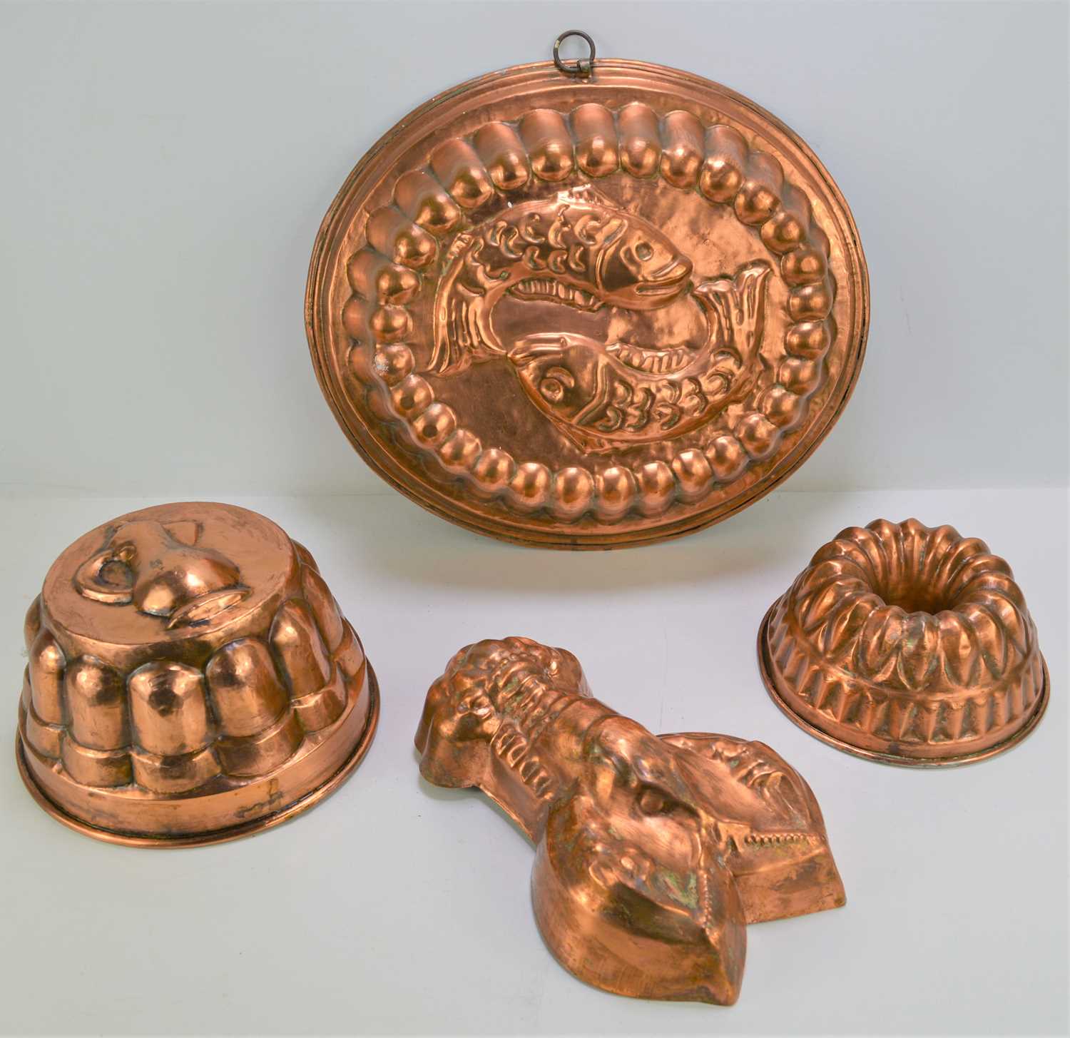 Lot 512 Three vintage copper jelly moulds, one in