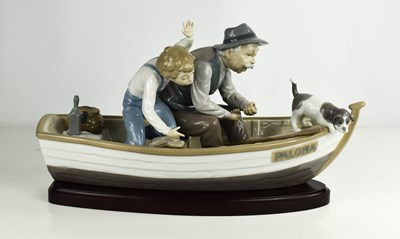 Lot 403 - A Lladro figure group titled Fishing with...