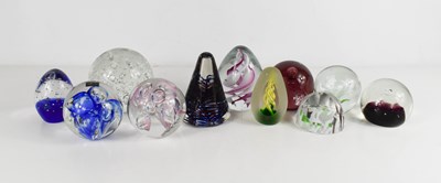 Lot 13 - A group of eleven glass paperweights, of...