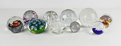 Lot 12 - A group of glass paperweights, of various size...