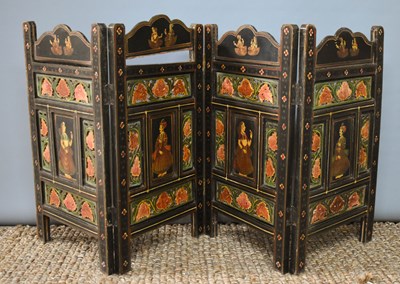 Lot 440 - An Indian four fold table screen, carved and...