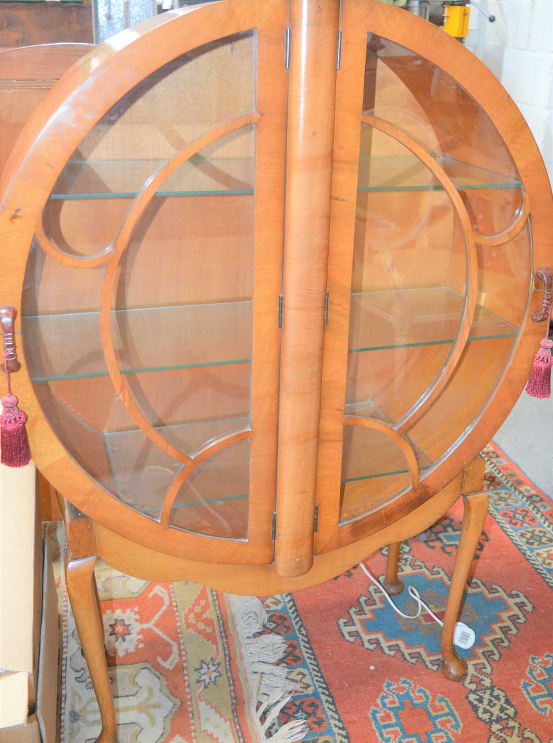 Lot 74 - An Art Deco veneered circular form cabinet...