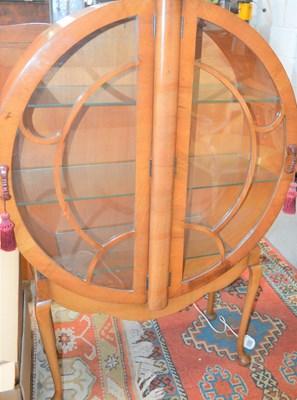 Lot 74 - An Art Deco veneered circular form cabinet...