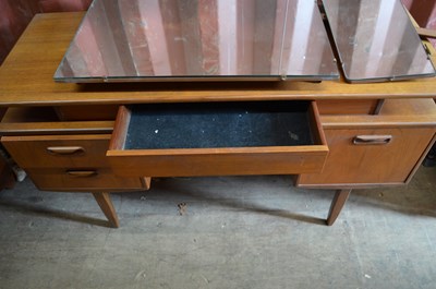 Lot 75 - A mid-century G-Plan teak dressing table.