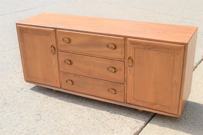 Lot 645 - A mid-century Ercol elm sideboard, with three...