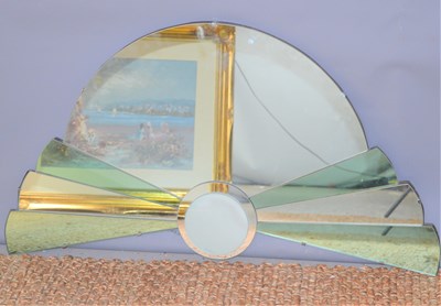 Lot 91 - An Art Deco style wall mirror in sunrise design.