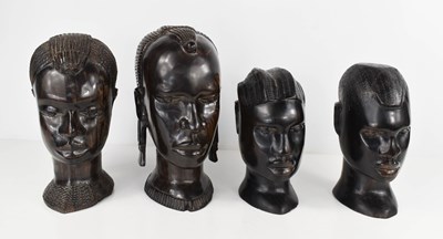 Lot 57 - Four carved ebony heads, mid 20th century,...