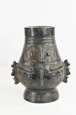 Lot 19 - A Chinese dark green jade carved vase, with...