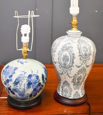 Lot 66 - Two modern blue and white ceramic table lamps.