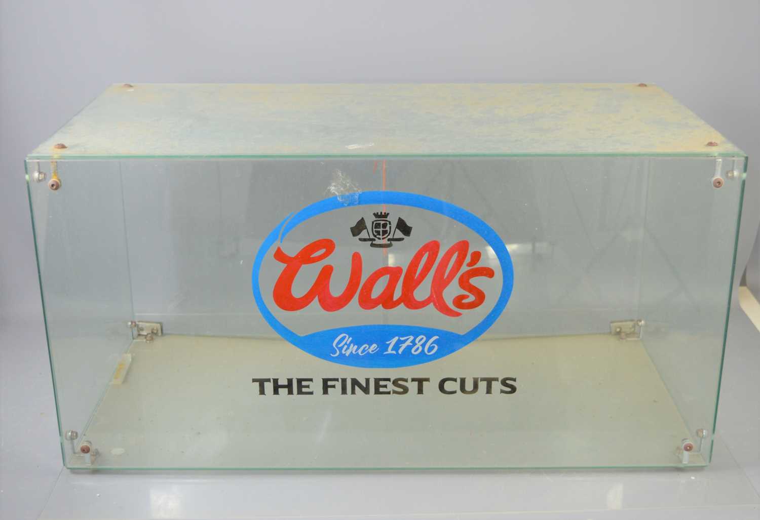 Lot 124 - A Wall's glass counter top display cabinet.