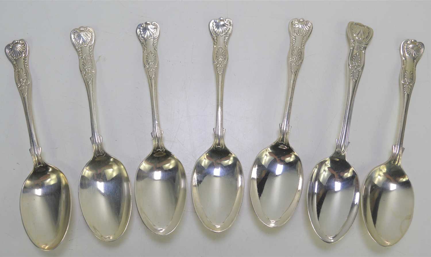 Lot 315 Seven silver dessert spoons in the Kings