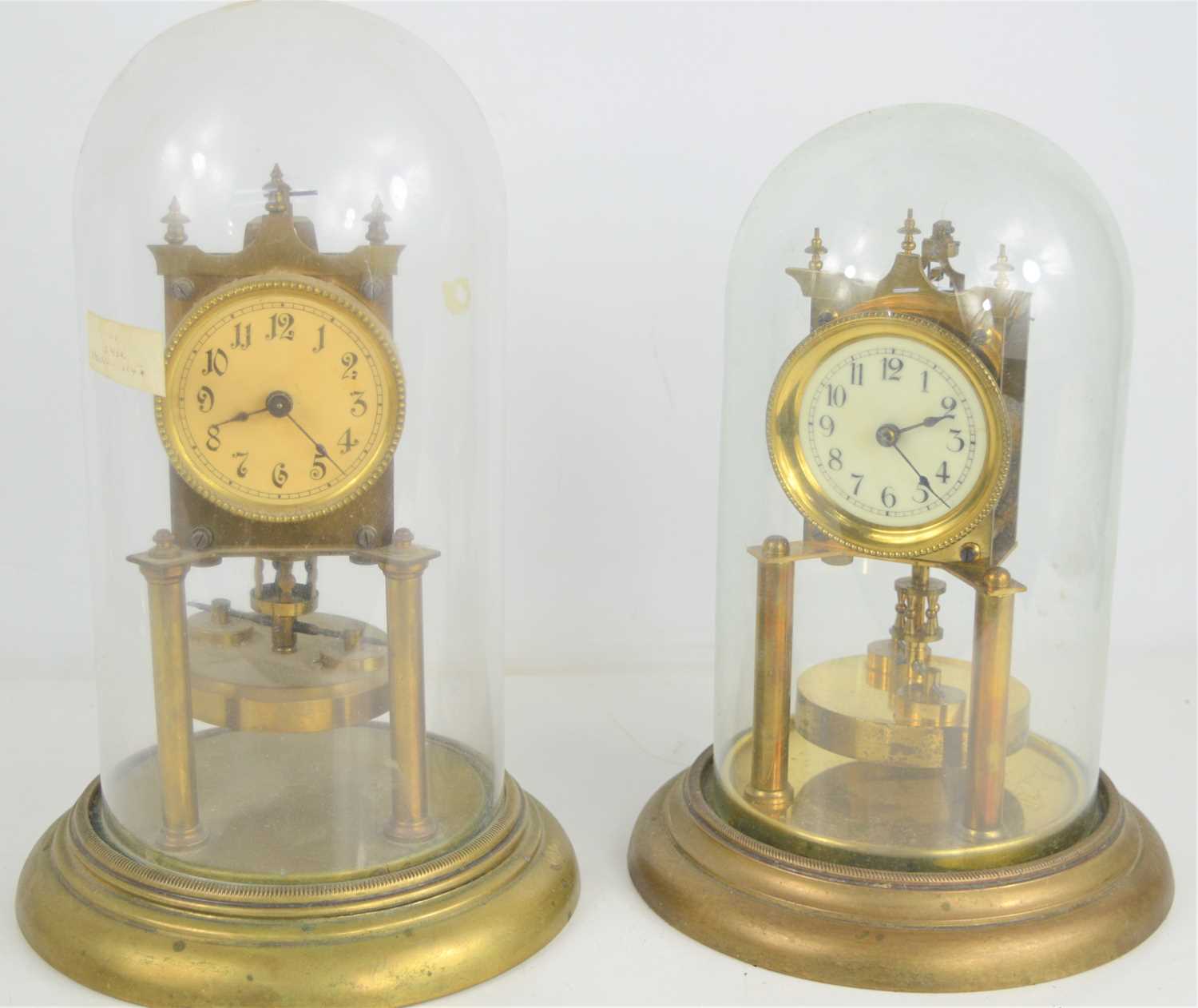 Lot 100 Two German torsion pendulum clocks, both