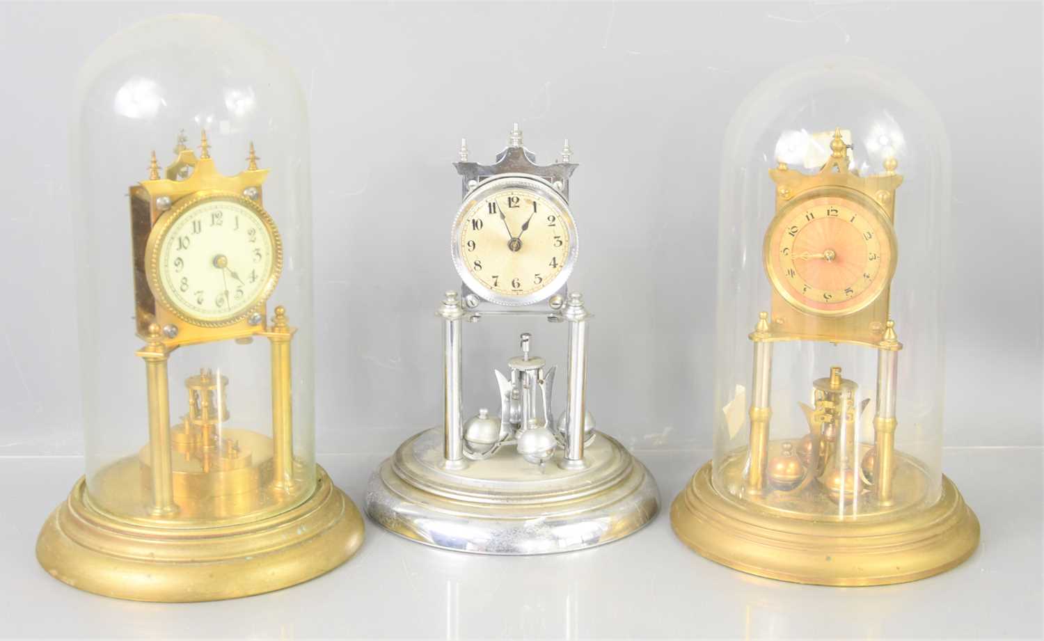 Three Pendulum Clock Lot 105 - Three 20th century torsion pendulum clocks,