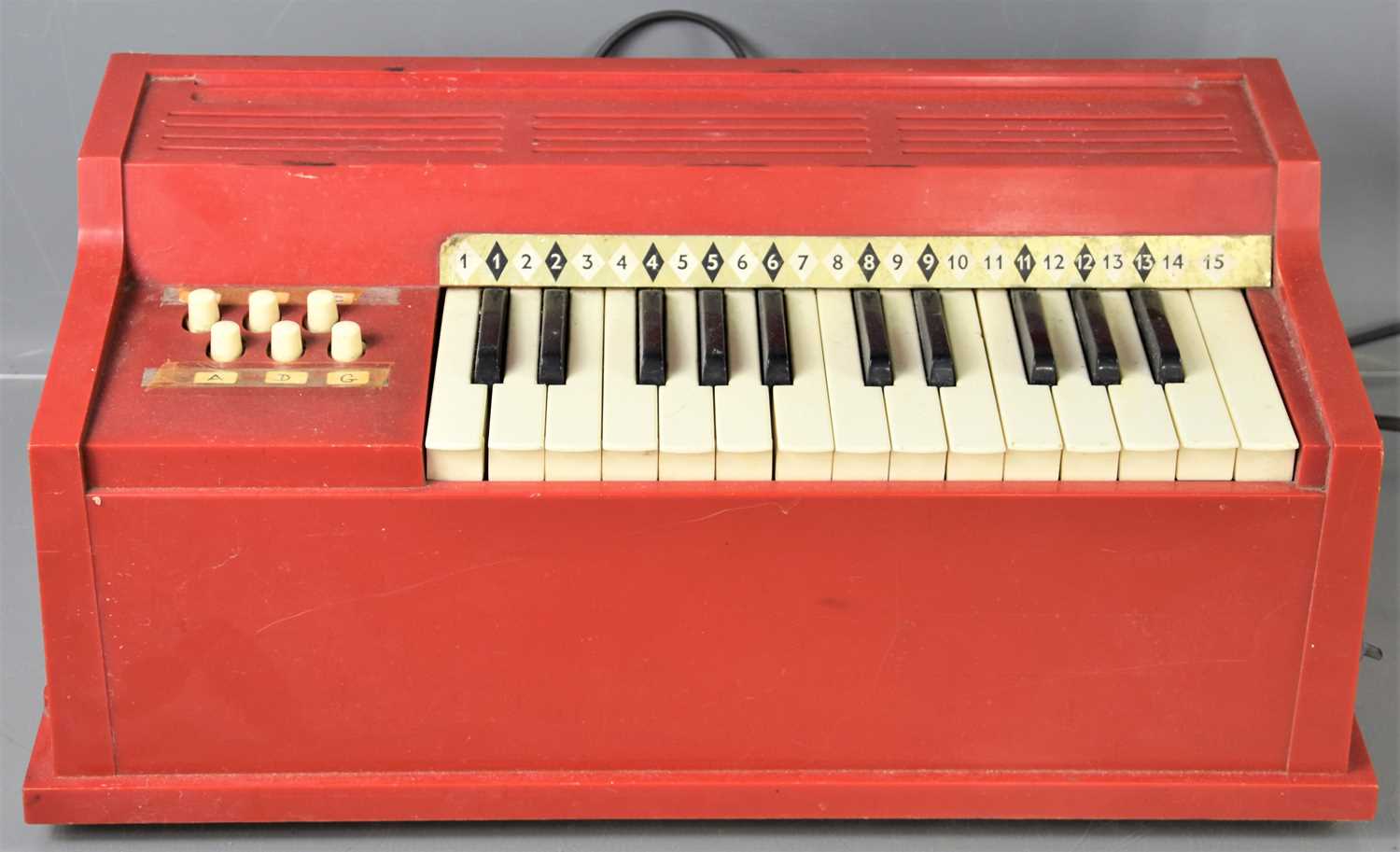 Lot 321 - A vintage electric childs organ possibly made...
