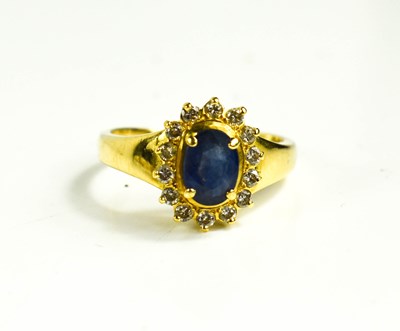 Lot 130 - An 18ct gold, sapphire and diamond ring, size...