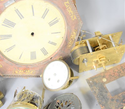 Lot 111 - A group of clock parts to include a brass...