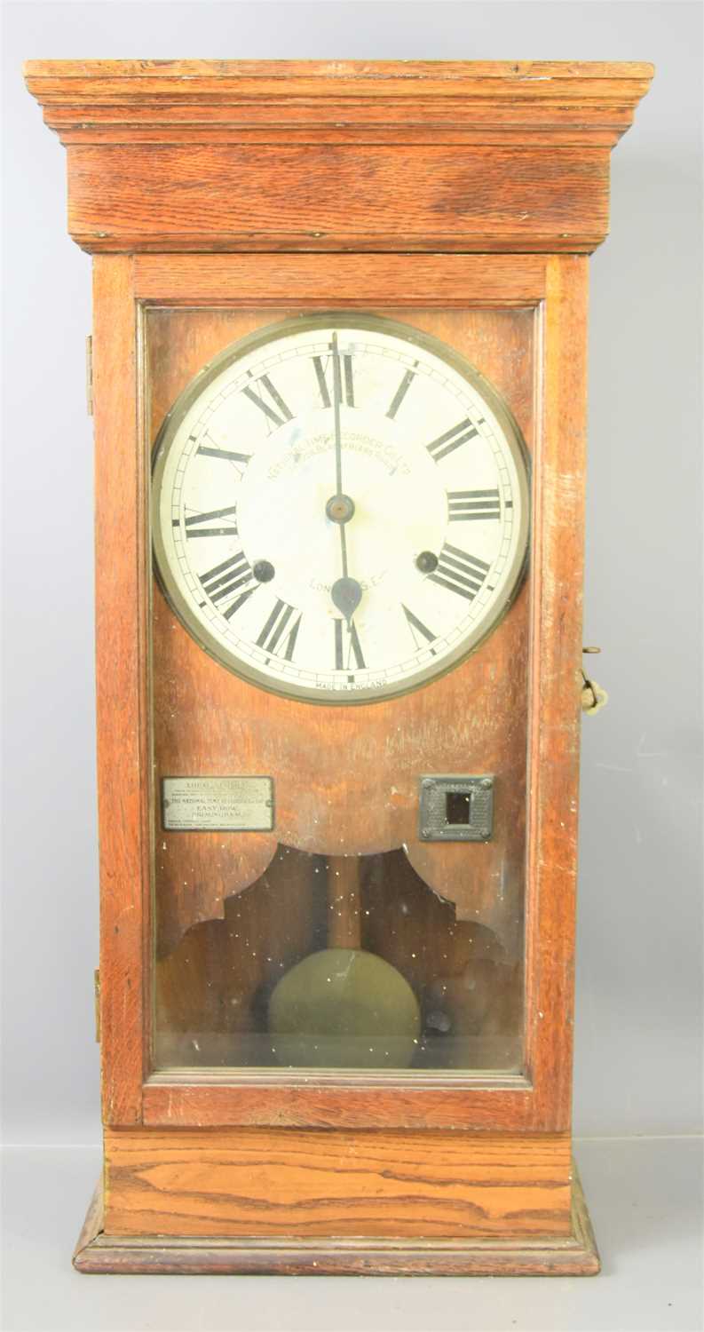 Lot 51 - A National Time Recorder Co Ltd oak cased wall-...