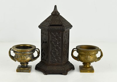 Lot 125A - A pair of souvenir gilt metal 'Warwick' urns,...