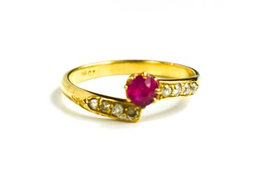 Lot 138 - An 18ct gold, ruby and diamond ring, central...