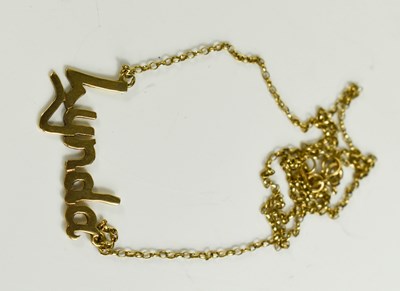 Lot 144 - A 9ct gold chain, set with a named pendant for...