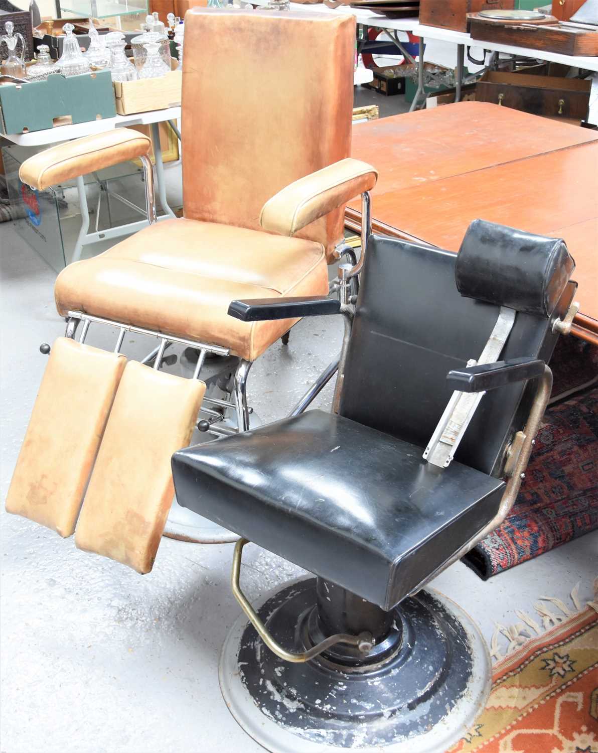 Lot 137 - Two barber's chairs, one with tan leatherette,...