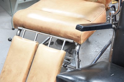 Lot 137 - Two barber's chairs, one with tan leatherette,...