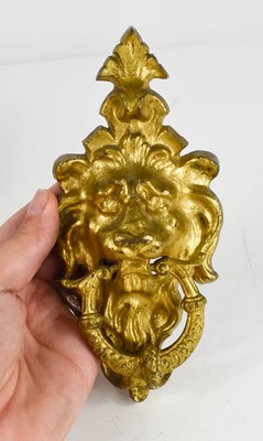 Lot 111A - A 19th century gilt metal door knocker, cast...